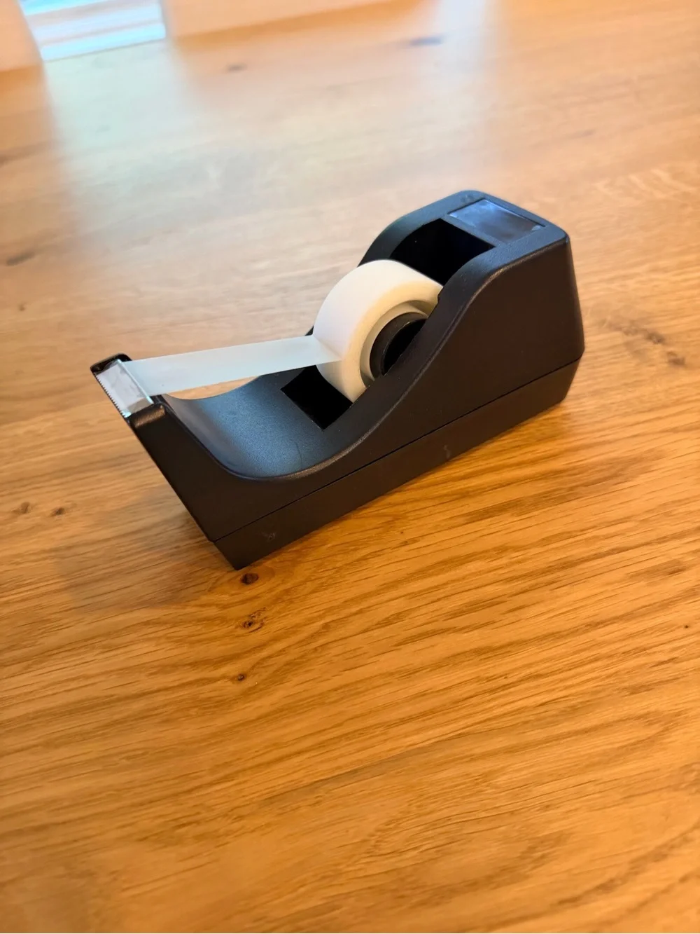 Black Desktop Tape Dispenser with White Roll of tape